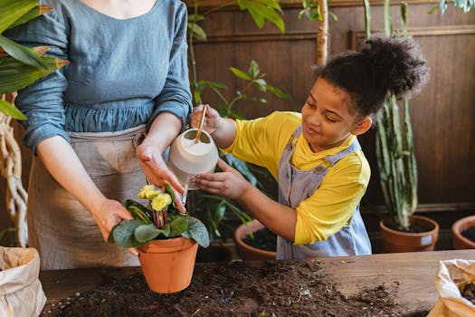 children watering plants together