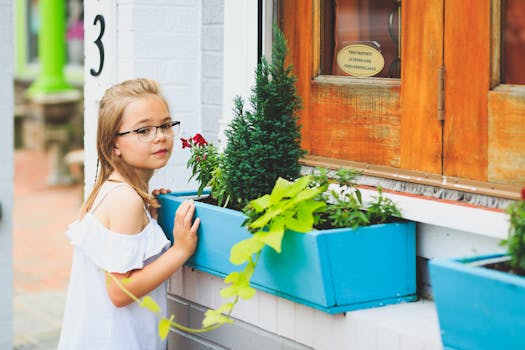 children measuring plant growth in the garden