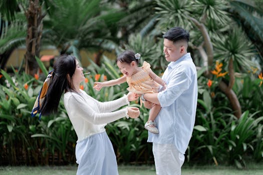 family planting seeds in the garden together