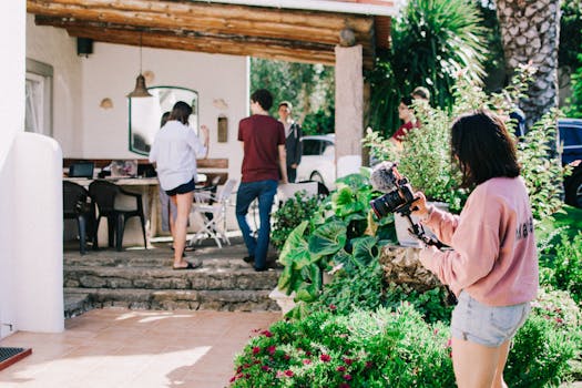 family planting flowers in garden