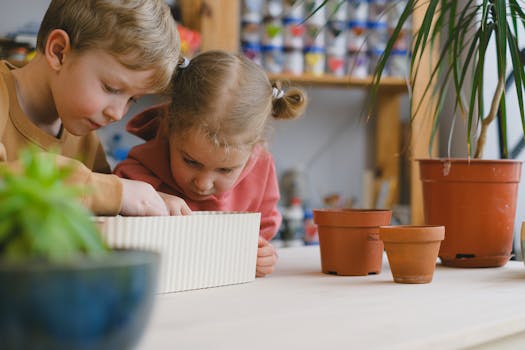 kids planting seeds in colorful pots