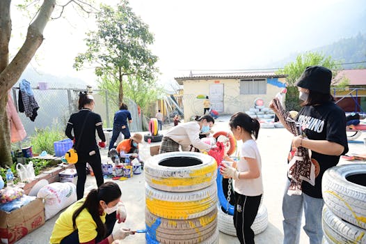 children painting pots for their garden