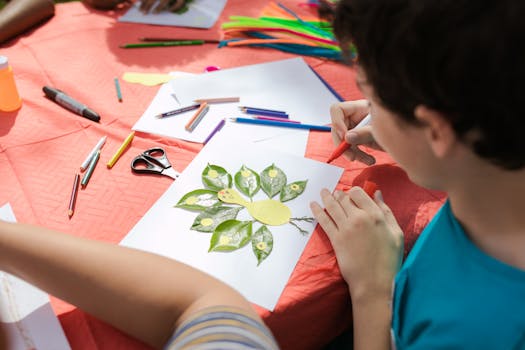 children working on a nature collage