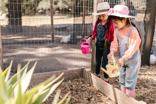 children observing plants in the garden