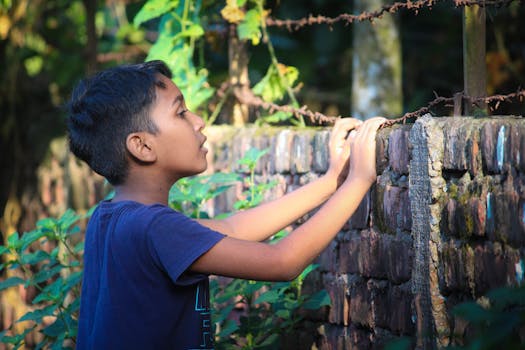 Children observing plants in their garden