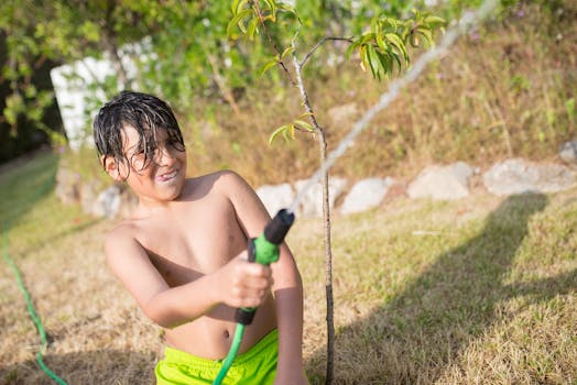 child watering plants